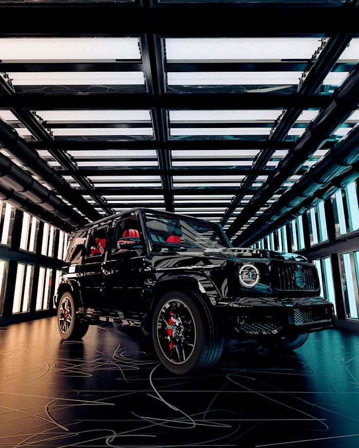Stunning black luxury SUV showcased in a sleek, illuminated showroom interior.